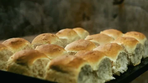 Hot fresh bread, steam, smoke Stock Footage 99602674