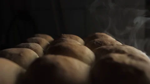 Hot fresh bread, steam, smoke Stock Footage 124690572