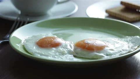 Hot fried eggs on plate close view.healthy breakfast Stock Footage 102883353