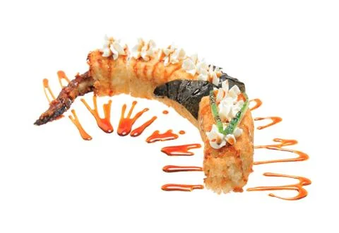 Hot fried sushi rolls in the shape of a dragon. Isolated on white background. Stock Photos