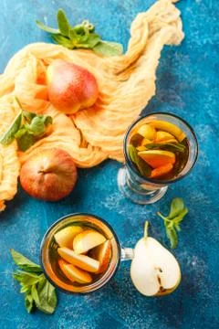 Hot fruit tea with ripe pears and mint Stock Photos