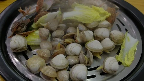 The hot gas of the well cooked shellfish Stock Footage 94228370