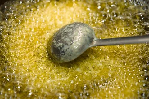Hot Ghee Bubbles and Spoon Stock Photos