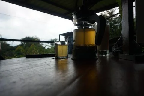 Hot ginger tea in cup with filter jar. Stock Photos