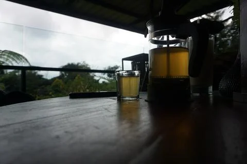 Hot ginger tea in cup with filter jar. Stock Photos