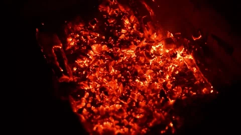 Hot glowing coal in a camp fire Video stock 314901437