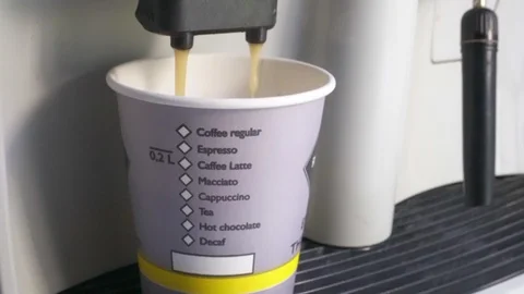 Hot grain coffee is poured into a mug. Coffee maker works. Stock Footage 110757388