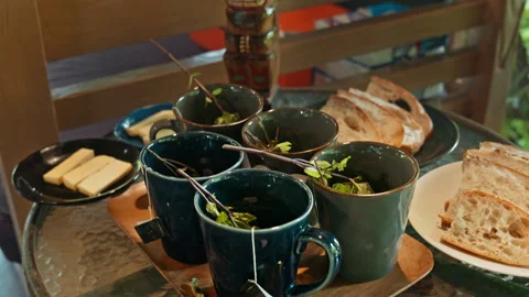 Hot herbal mint tea drink in mugs over wooden tray with fresh garden mint l.. Stock Footage 341240759