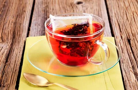 Hot herbal tea with fruit in a glass cup Foto stock