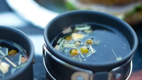 Hot herbal tea in a teacup. Stock Footage 81757167