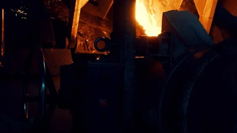 Hot iron is processed in the foundry. pouring hot lava in foundry. foundry 库存影片 112777378