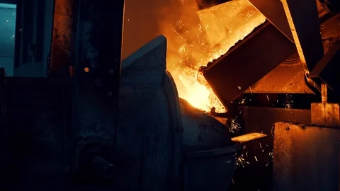 Hot iron is processed in the foundry. pouring hot lava in foundry. foundry Stock Footage 112777472