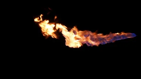 Hot jet of fire across frame isolated on black Stock-Footage 77134384