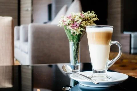 Hot latte coffee cup on table Stock Photos