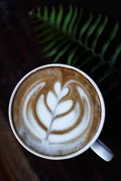 Hot Latte Cup With Art On Rustic Dark Wooden Table Overhead View Close Up Sho Фото