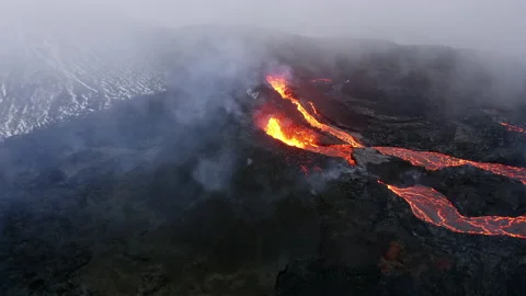 Hot lava thrown out of active volcano in Iceland Aerial Video stock 156466080