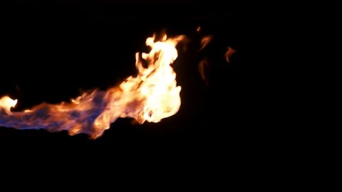 Hot lick of continuous flame shot in studio in slow motion Vídeo Stock 77134389