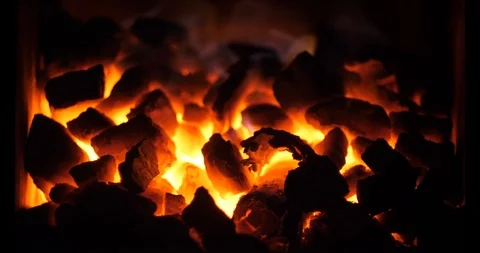 Hot lighted middle of coal heap in oven Rural home heating Stock Footage 98485776