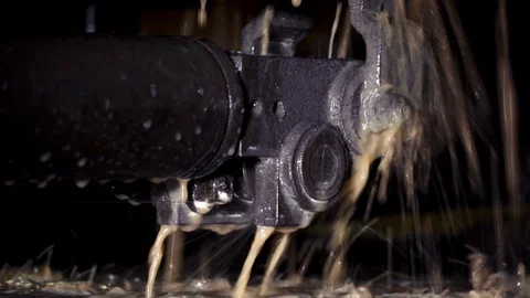 Hot line glides on the machine in the workshop. Watering with cold water to cool Stock Footage 116443913