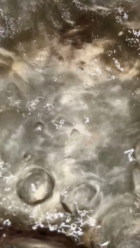 Hot liquid boils with large bubbles in metal pot Video stock 331982254