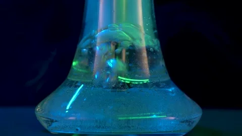 Hot liquid in hookah flask bubbles emitting steam at smoking Stock Footage 195957007