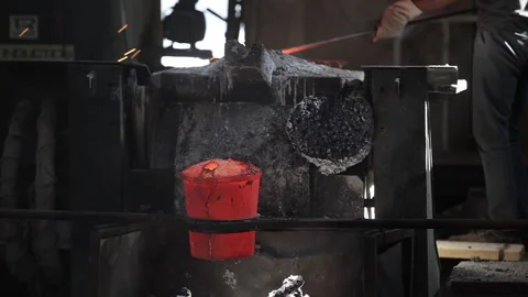 Hot Liquid Metal Stream is Pouring from Induction Foundry Furnace. Stock Footage 296802893