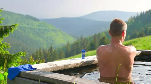Hot Man Having a Bath in the Mountains Stock Footage 64997982