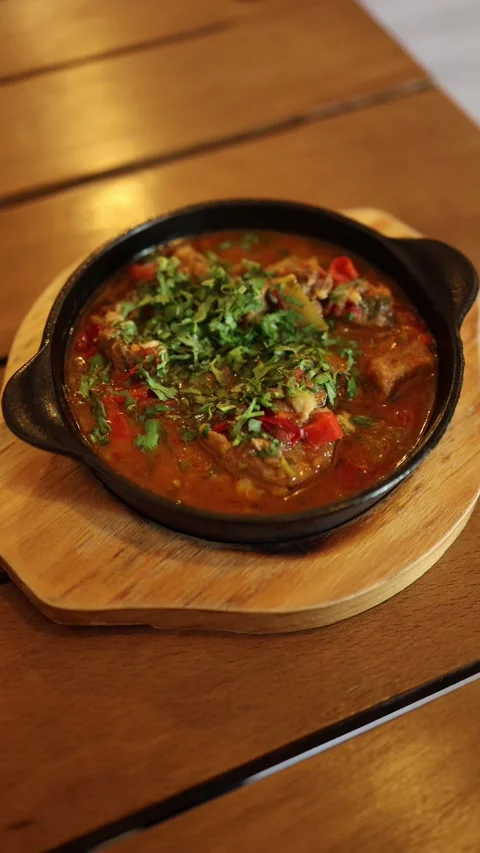 Hot meat stew in rustic pan Stock Footage 331023770