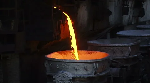 Hot melted iron falls into container. Stock Footage 54901992
