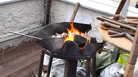 Hot Metal in a Blacksmith Forge Stock Footage 62076622