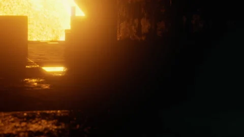 Hot metal flows in a dark foundry setting during working hours Stock Footage 344965265