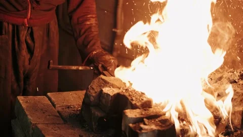Hot Metal in a Forge. Blacksmith pulls a hot piece of metal out of the burning 스톡 동영상 149207815