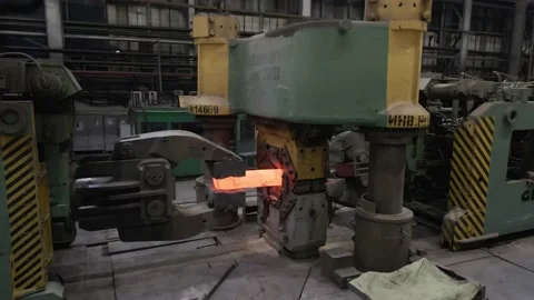 Hot metal piece in a large press Stock Footage 222776896