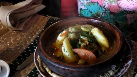 Hot Moroccan tagine steaming on the table Stock-Footage 101268660