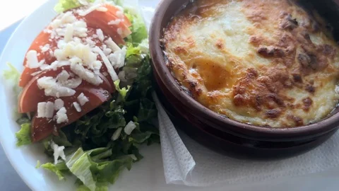 Hot Moussaka dish made in a ceramic pot. Homemade Greek traditional dish. Stock Footage 120357259