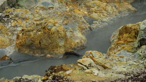 Hot mud flow and steam in the active crater area Stock Footage 319907160