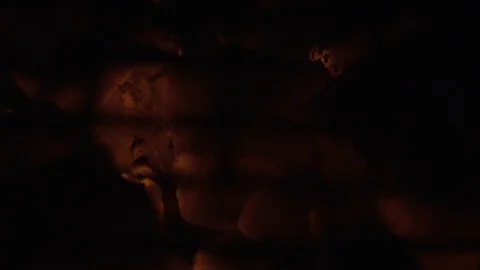 Hot orange coals can be seen through the grate Stock Footage 117991527
