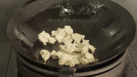 Hot pan with chicken frying Stock Footage 88570839