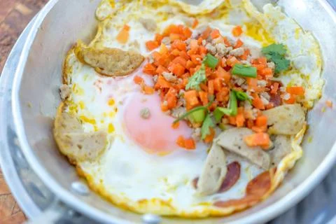 Hot pan fried egg stuff with minced pork and sausage Stock Photos