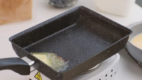 A hot pan on the stove ready for frying. Fried bread slices for breakfast. Stock Footage 242565413