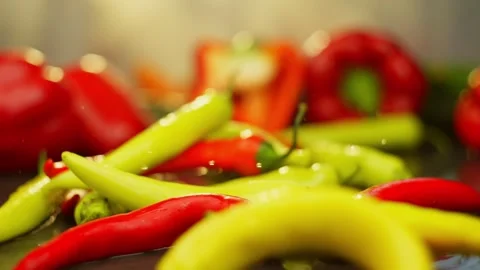 Hot pepper falls on the table among fresh vegetables for cooking Stock Footage 296362079