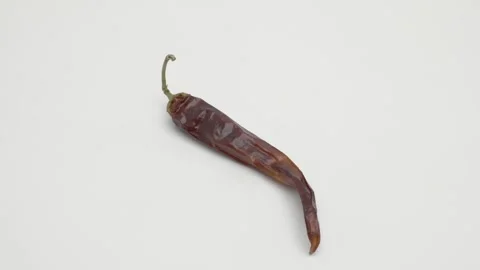 Hot pepper rotates on a white background. Stockbeeldmateriaal 270143932