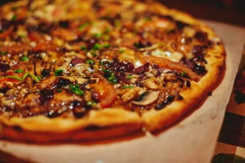 Hot pizza close up warm light Stock Photos