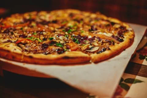 Hot pizza close up warm light Stock Photos