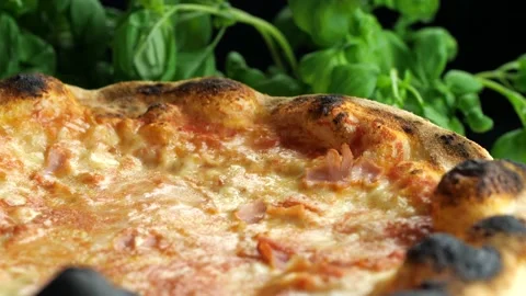 Hot pizza rotating and basil on the background Stock-Footage 168387289