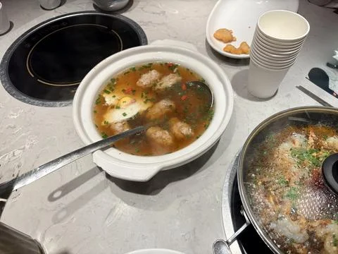 Hot Pot and Soup on a Table. Fotos de archivo