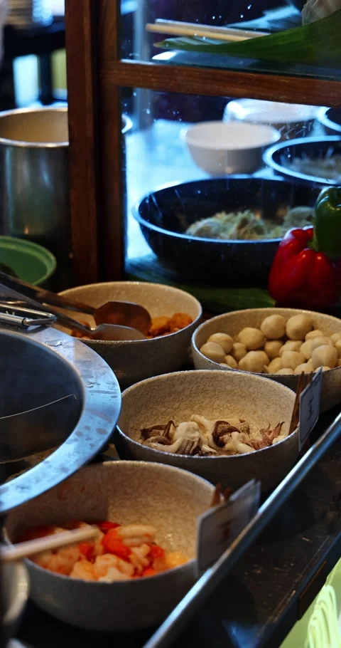 Hot Pot Buffet Ingredients Displayed in Restaurant Stock Footage 323944714