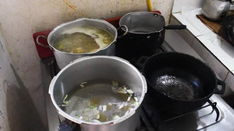 Hot pots on a stove Stock Footage 292775183