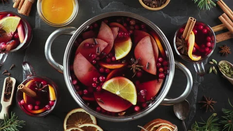 Hot punch or mulled wine at Christmas in a cooking pot Stock Footage 143721889