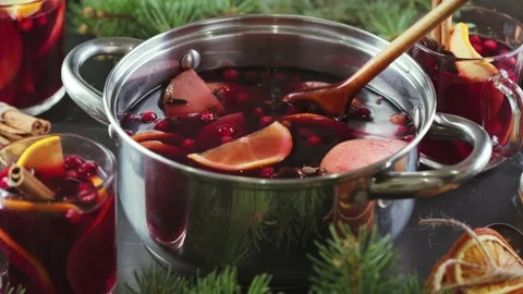 Hot punch or mulled wine at Christmas in a cooking pot Stock Footage 145344357